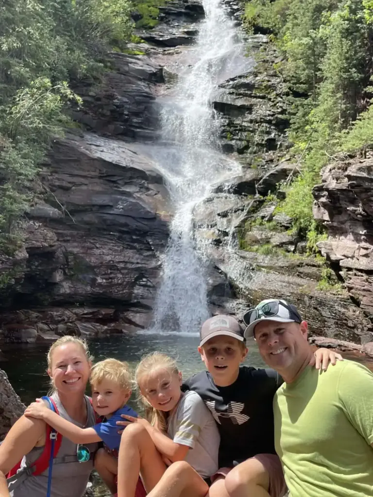 Family by a waterfall